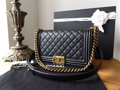 chanel le boy black caviar gold hardware|The Ultimate Guide to the Chanel Boy Bag .